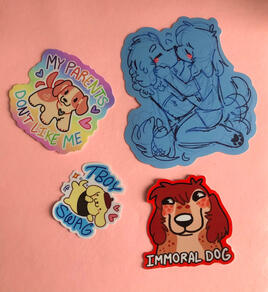 A set of four stickers on a pink background. The first shows a little dog in front of a pastel rainbow background with the pastel rainbow text “MY PARENTS DON’T LIKE ME” framing him. He is cream colored with orange patches, dot eyes, and a friendly expres